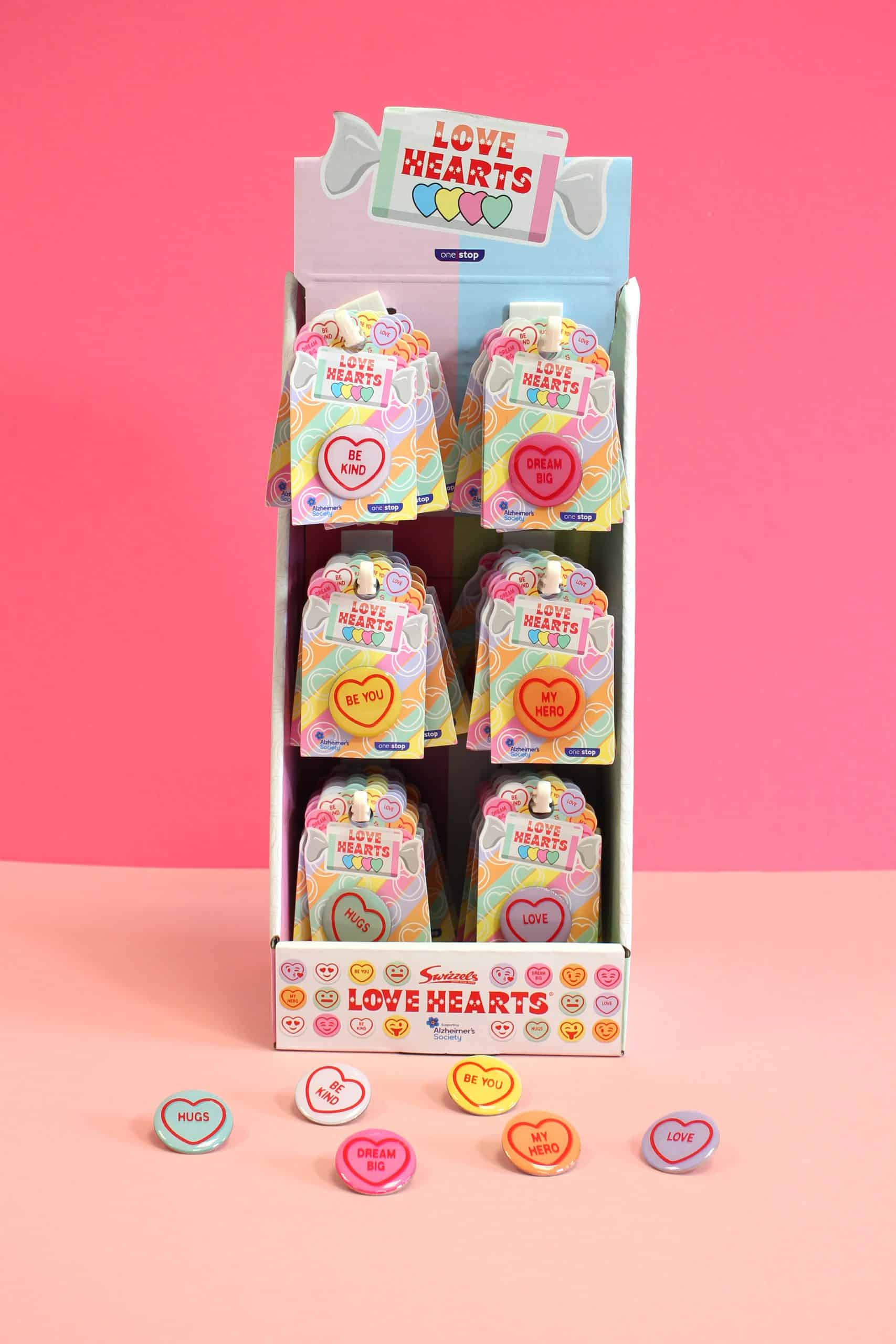One Stop team up with Swizzels and Alzheimer’s Society to launch Love Hearts pin badges