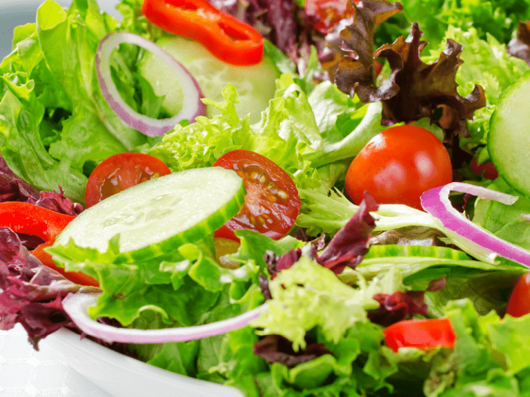 A Salad being tossed in the air